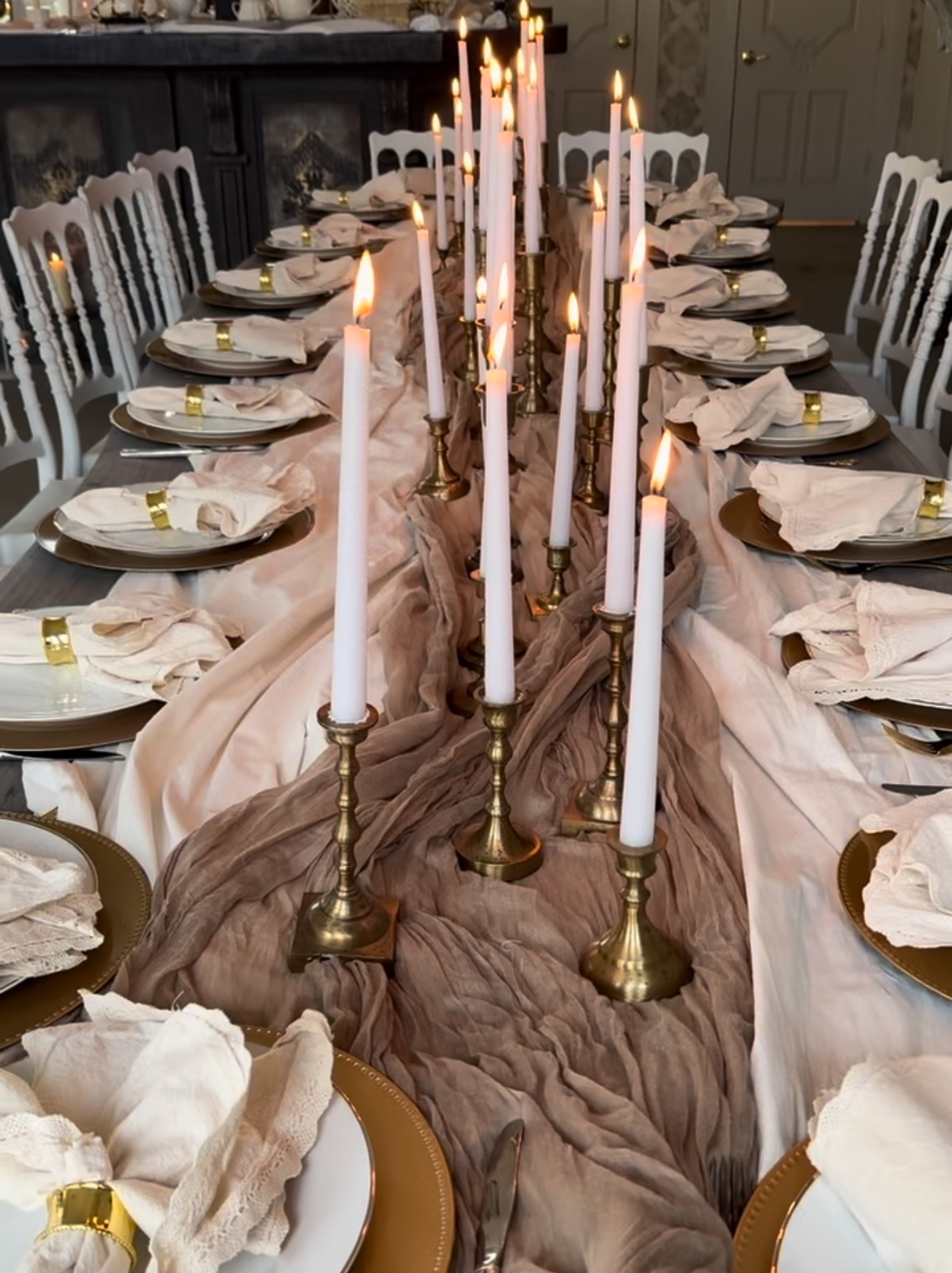Long candlelit table beneath the orchard sky